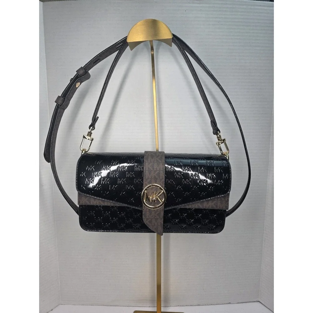 Michael Kors Greenwich medium logo-embossed patent leather shoulder bag in black